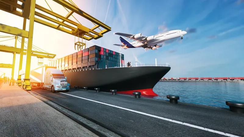 Container ship at port with a cargo plane overhead